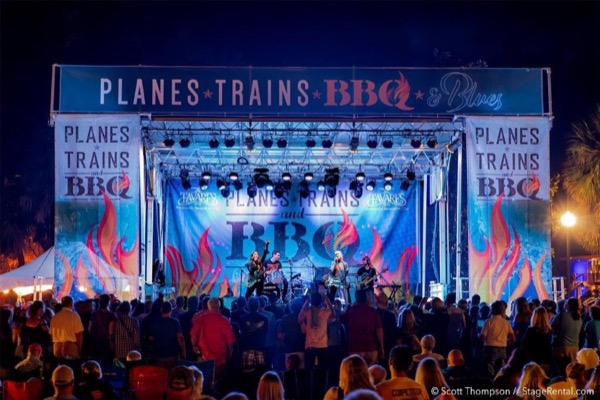 Stageline SL100 stage at the Planes Trains BBQ festival with a crowd in front